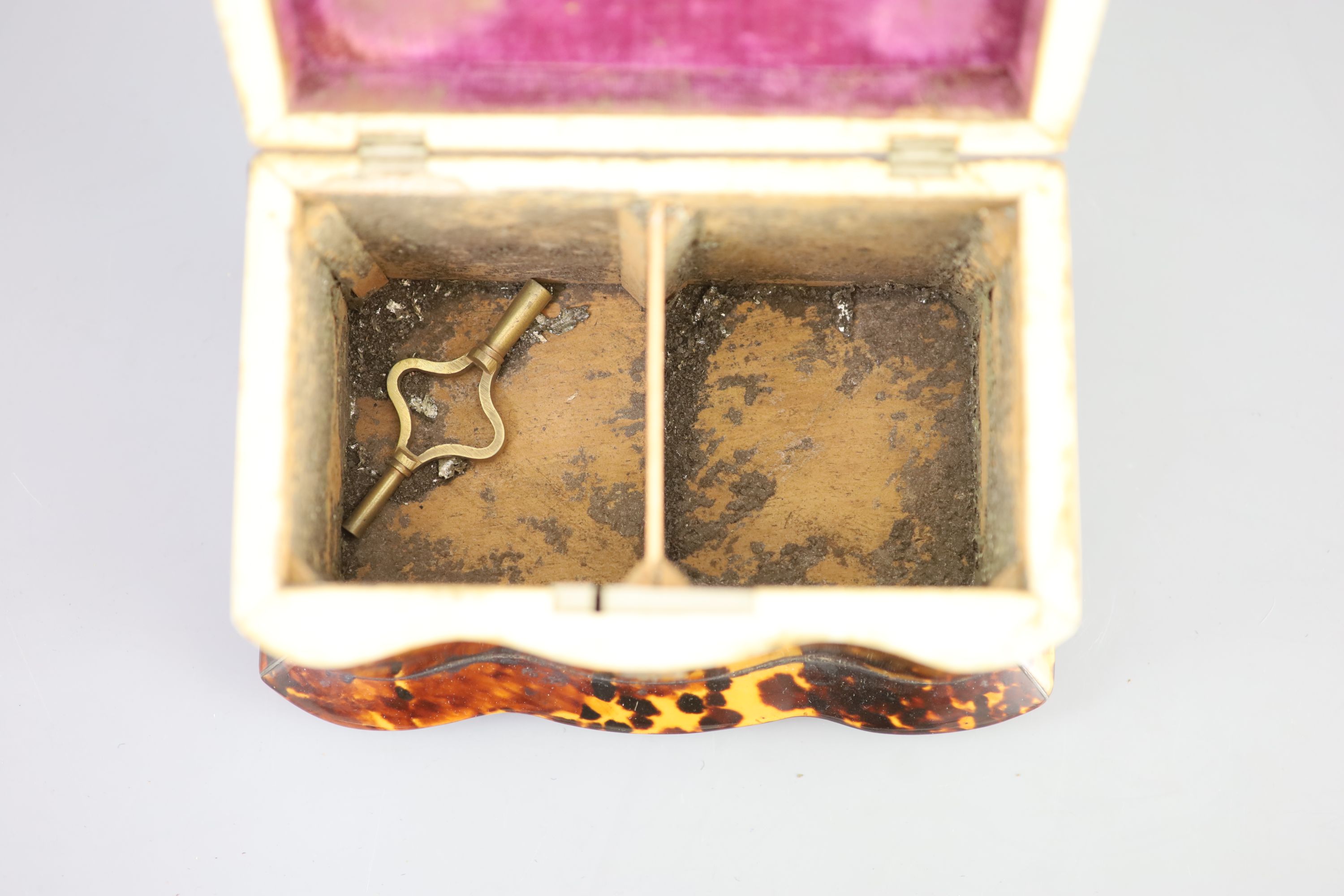 A 19th century tortoiseshell tea caddy, 18cm wide, 11cm deep, 11.5cm high.